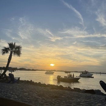 Sneaky Tiki Bar - the sun setting over the water - Tiki Bars Near Me - Pensacola Beach, Florida