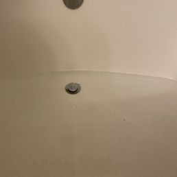 Slow draining water in tub.