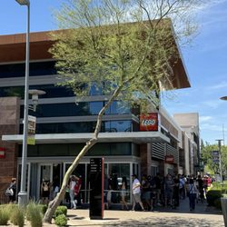 Exterior with line of people around the corner