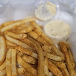 Fandango's Sports Bar and Grill - Basket Of Fries, seasoned with a side of cheese sauce
