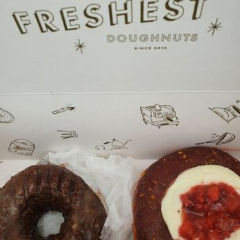 Sidecar Doughnuts & Coffee - One chocolate cake gluten-free donut and one sugarfina donut. - Donuts Near Me - Costa Mesa, California