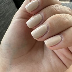 Modern Nails Salon - Chipped polish, clear coat not covering colored polish. Poor cuticle trimming. Polish not painted to cover fill nail bed.