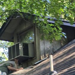 Steven Mulkey's Handy Man service - Steven Mulkey, from Dawsonville, GA detaching our extremely heavy A/C unit, which was firmly attached to our second story roof.