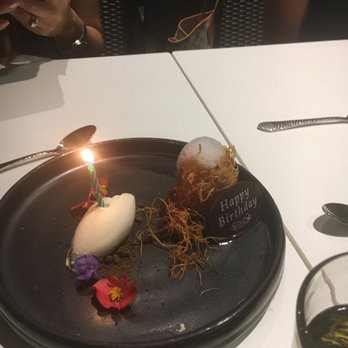 Xochi - Fried plantain w birthday candle. Pretty good but very petite - Mexican Near Me - Houston, Texas Xochi - Fried plantain w birthday candle. Pretty good but very petite - Mexican Near Me - Houston, Texas