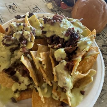 Tejas Chocolate Craftory - Brisket nachos condiments on the side - Chocolatiers & Shops Near Me - Tomball, Texas Tejas Chocolate Craftory - Brisket nachos condiments on the side - Chocolatiers & Shops Near Me - Tomball, Texas