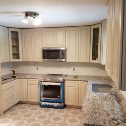Cabinets To Go - Half-way completed.  Missing flooring, sink, lighting, back-splash, toe-kick, pulls and fridge.