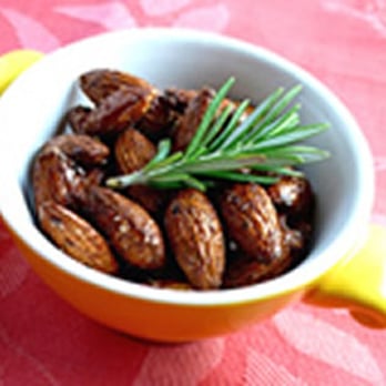 Outrageous Offerings - a bowl of nuts with a sprig of rosemary - Specialty Food Near Me - Kirkland, Washington Outrageous Offerings - a bowl of nuts with a sprig of rosemary - Specialty Food Near Me - Kirkland, Washington