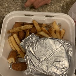 Burger and fries with half eaten hush puppies
