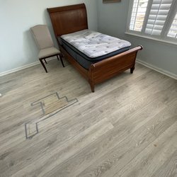 Direct Flooring Liquidators - Before floor with water damaged area identified