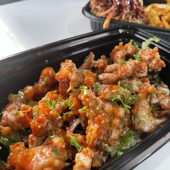 Sauwces Kitchen - two takeout containers of food - Food Trucks Near Me