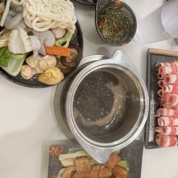 Hotpot 88 - Mushroom broth with beef in the back - Pan Asian Near Me - Omaha, Nebraska