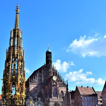 Frauenkirche - With Schöner Brunnen in the foreground from the far end of the Christkindlesmarkt-famed Hauptmarkt - Churches Near Me - Nuremberg, BY
