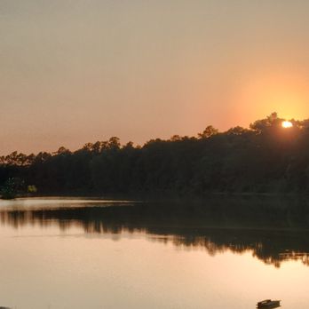 Emerald Lake Naturist Resort - A stunning sunset across a golden lake. - Resorts Near Me - Porter, Texas