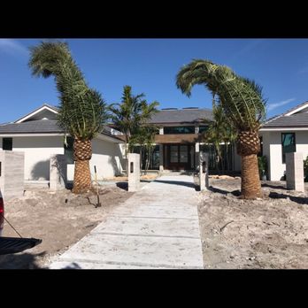 Melkris Landscaping Services - Canary Date Palm Installation - Tree Services Near Me Melkris Landscaping Services - Canary Date Palm Installation - Tree Services Near Me