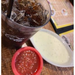 a cold drink with ice and sauce a cold drink with ice and sauce