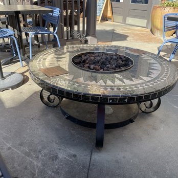 Tupelo Honey Southern Kitchen & Bar - Warning sign on fire pit to not touch fire! Lol - Southern Near Me - Myrtle Beach, South Carolina