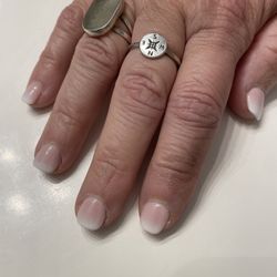 Sassy Nails - Nail tip with a dip. The polish is light pink and white air brush at the end.