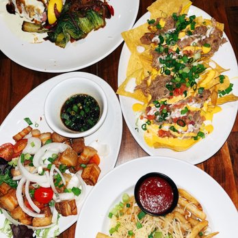 Restaurant 604 - Mac Nut Mahi Plate, Drunken Kalua Nachos, Garlic Fries, and Crispy Roast Pork. - Breakfast & Brunch Near Me - Honolulu, Hawaii