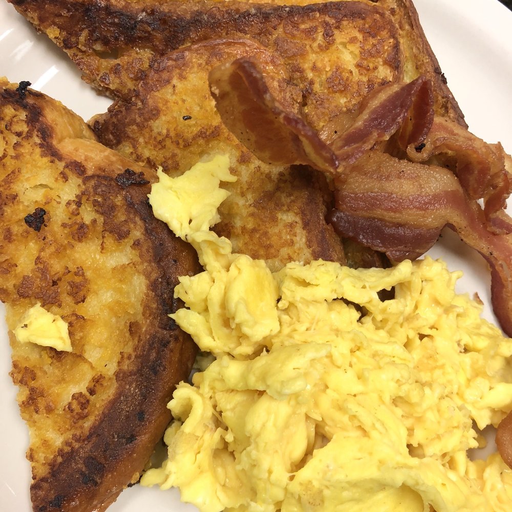 Bagelmania Restaurant - Krispy Challah French Toast combo with 2 scrambled eggs and bacon! - Bagels Near Me - Sunrise, Florida Bagelmania Restaurant - Krispy Challah French Toast combo with 2 scrambled eggs and bacon! - Bagels Near Me - Sunrise, Florida