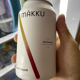 a person holding a can of food