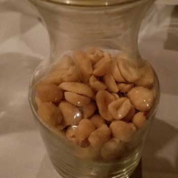 Clearman's Steak 'N Stein - A vase of peanuts. Not sure why this was here. Also not sure if these peanuts ever get changed or just reused. - Steakhouses Near Me - Pico Rivera, California