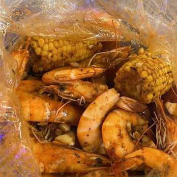 Cajun Crack'n - Signature combo 1. 2lbs of shrimp and 1lb of crawfish with corn, potatoes and sausages. - Seafood Near Me - Milpitas, California Cajun Crack'n - Signature combo 1. 2lbs of shrimp and 1lb of crawfish with corn, potatoes and sausages. - Seafood Near Me - Milpitas, California