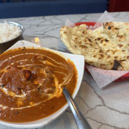 Butter chicken, rice, and butter nan Butter chicken, rice, and butter nan