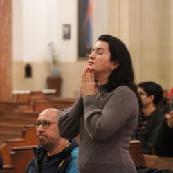 Blessed Sacrament - A parishioner prays during mass.