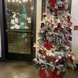 Christmas tree inside overlooking g lake through back door Christmas tree inside overlooking g lake through back door