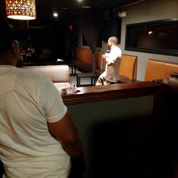 78 Lounge / Restaurant - a man standing at a bar - Lounges Near Me - Union, New Jersey