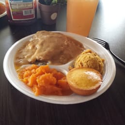 Smothered Pork chop w/rice n gravy, candied yams, cornbread dressing, and cornbread muffin with Papppa's Mix to drink. Smothered Pork chop w/rice n gravy, candied yams, cornbread dressing, and cornbread muffin with Papppa's Mix to drink.