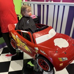 Sharkey's Cuts For Kids - Lightning McQueen has seen better days, but little man was still happy to turn the steering wheel and push the buttons.