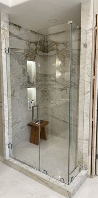 Chandler Bathroom Remodel - The remodel involved a ton of demo work, lots of pop-outs were demoed, revelaing an open and airy space in the bathroom. The original bathtub was demoed and the tile surround it was in. Herringbone tile was added as a backsplash for the newly installed freestanding tub. There was some reframing of the walls in the master which was adjacent to the shower. We took out the out-dated glass block wall and squared off the shower space, giving it a modern upgrade. The shower walls are custom granite slabs and the herringbone backsplash was carried over into the niches of the shower with that gorgeous custom lighting to really set it apart.
