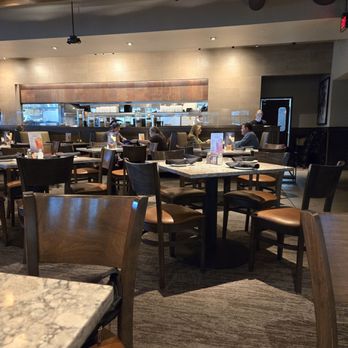 Firebirds Wood Fired Grill - A view from our table looking towards the kitchen. Very nice interior.  Nice Vibes. - Steakhouses Near Me - Murfreesboro, Tennessee