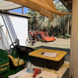 a tractor and a carton of fruit