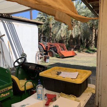 Fresh Dates By Anderson - a tractor and a carton of fruit - Farmers Market Near Me - Thermal, California