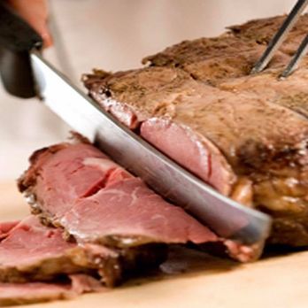 Wellingtons - a person slicing a piece of meat - Breakfast & Brunch Near Me - Jackson, Mississippi