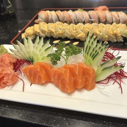 Salmon sashimi, Shaggy dog sushi roll, Mt. Fuji roll, and double double roll