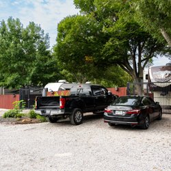 Skyline RV Park - Shaded RV sites with individual gates, wooden privacy fencing, and parking just outside your space.