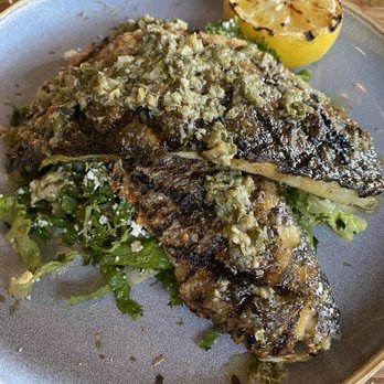 Taverna Philosophia - Whole roasted Branzino, fileted and served over a chopped salad of romaine, feta, lemon juice and olive oil. Perfection! - Mediterranean Near Me - Mount Pleasant, South Carolina Taverna Philosophia - Whole roasted Branzino, fileted and served over a chopped salad of romaine, feta, lemon juice and olive oil. Perfection! - Mediterranean Near Me - Mount Pleasant, South Carolina