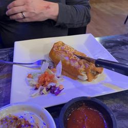 Zury’s taco Bar - Panther burrito, complimentary chips and salsa with chorizo queso.