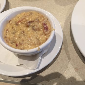 Wild Eggs - Grits of the day: Grits, Butter, chorizo - Breakfast & Brunch Near Me - Lexington, Kentucky