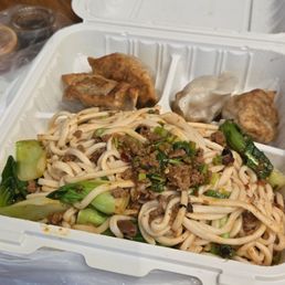 Dan dan noodles with pork chive dumplings and vinegar on the side