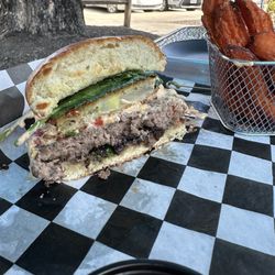 Paladin Woolen Mill - Paladin burger- Perfectly cooked beef, fried green tomato, bacon jam, spinach on brioche bun