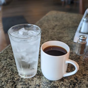 Early Bird - a cup of coffee and a glass of water - Breakfast & Brunch Near Me - Pinellas Park, Florida