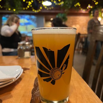 Jackie O's Brewpub - a glass of beer on a table - Brewpubs Near Me - Athens, Ohio
