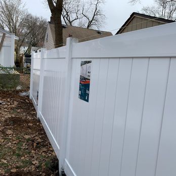 Excellent Landscaping - a white fence with a sticker on it - Landscaping Near Me - Newark, New Jersey
