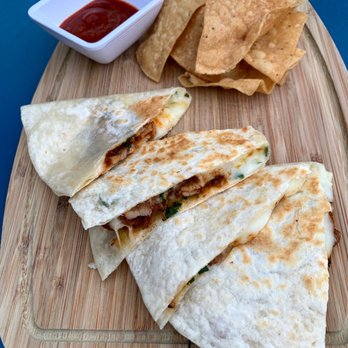 Taberna - quesadillas and chips on a cutting board - Tapas Bars Near Me - La Verne, California
