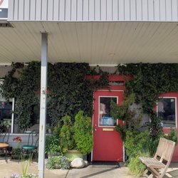 Sushi Ocean View - Greenery at entrance Creative seashore wall art and framed paintings by Mark available inside for purchase. Food & Faith are amazing.