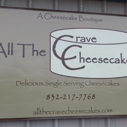 All the Crave Cheesecakes - Logo for their business. Very small storefront in a beige metal building.